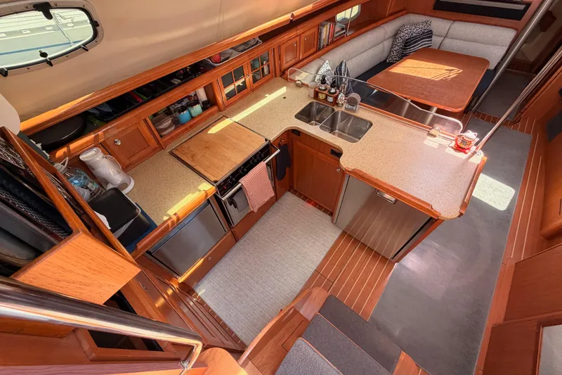 Slide: The Image of Luxurious interior of 2008 Hunter 45 Deck Salon yacht with modern kitchen and dining area. - 49