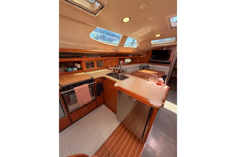 Slide: The Image of Luxurious interior of 2008 Hunter 45 Deck Salon yacht with modern kitchen amenities. - 54
