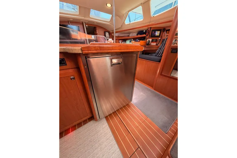 Slide: The Image of Interior of 2008 Hunter 45 Deck Salon yacht, featuring a modern kitchen area. - 56