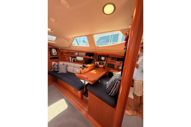 Slide: The Image of Interior of 2008 Hunter 45 Deck Salon yacht with cozy seating and navigation area. - 61