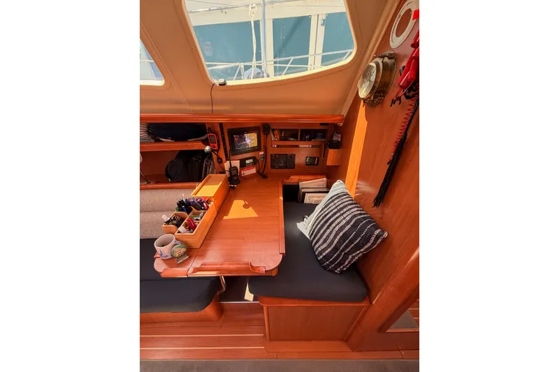 Slide: The Image of Interior of 2008 Hunter 45 Deck Salon with navigation station and cozy seating area. - 62
