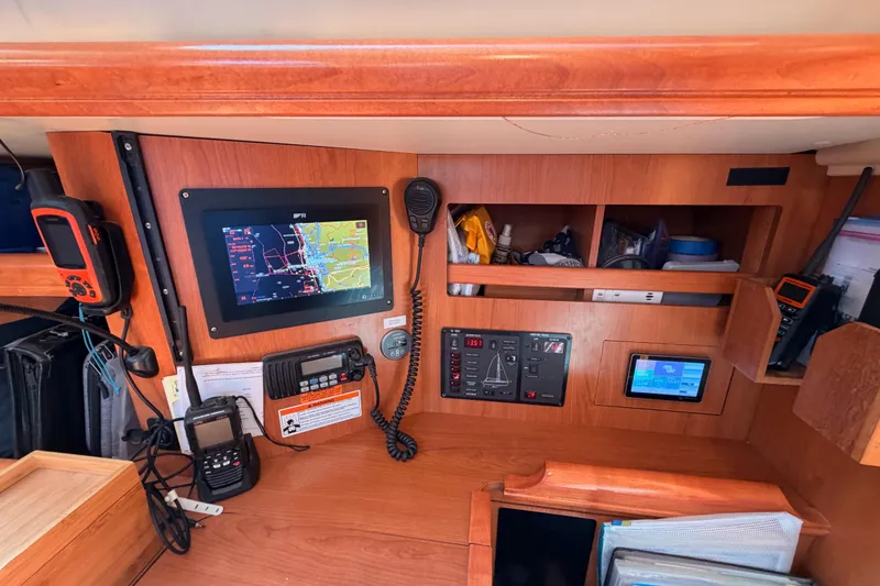 Slide: The Image of Navigation and communication equipment inside a 2008 Hunter 45 Deck Salon yacht. - 64