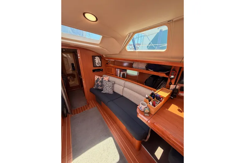 Slide: The Image of Interior of 2008 Hunter 45 Deck Salon yacht with cozy seating and wooden accents. - 69