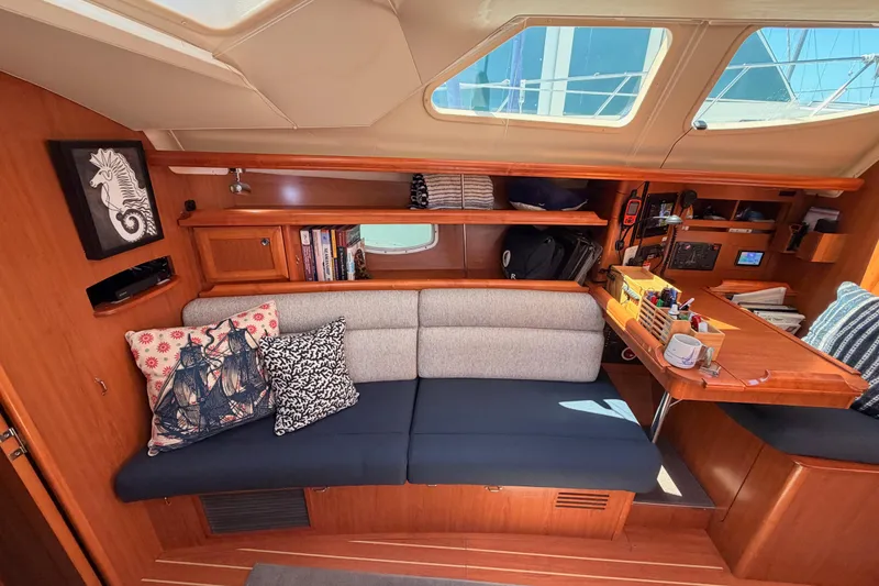 Slide: The Image of Interior of 2008 Hunter 45 Deck Salon with cozy seating and nautical decor. - 70