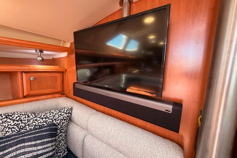 Slide: The Image of Interior of 2008 Hunter 45 Deck Salon with TV and soundbar setup. - 72