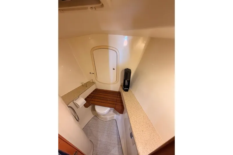 Slide: The Image of Bathroom interior of 2008 Hunter 45 Deck Salon yacht, featuring compact design and wooden accents. - 79