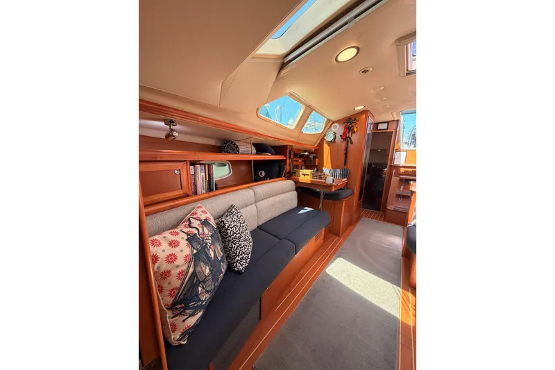 Slide: The Image of Interior of 2008 Hunter 45 Deck Salon yacht with cozy seating and skylight. - 84