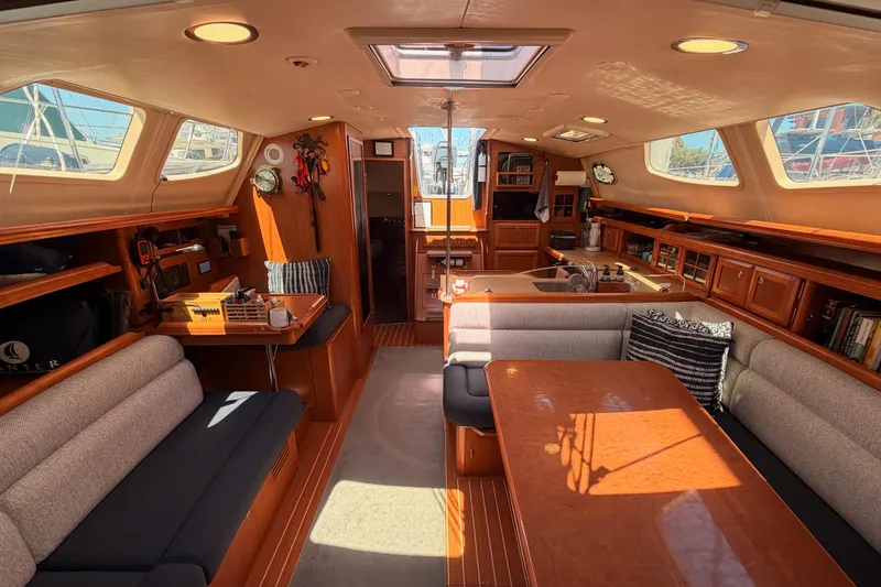 Slide: The Image of Interior of 2008 Hunter 45 Deck Salon yacht with spacious seating and elegant wood finishes. - 86