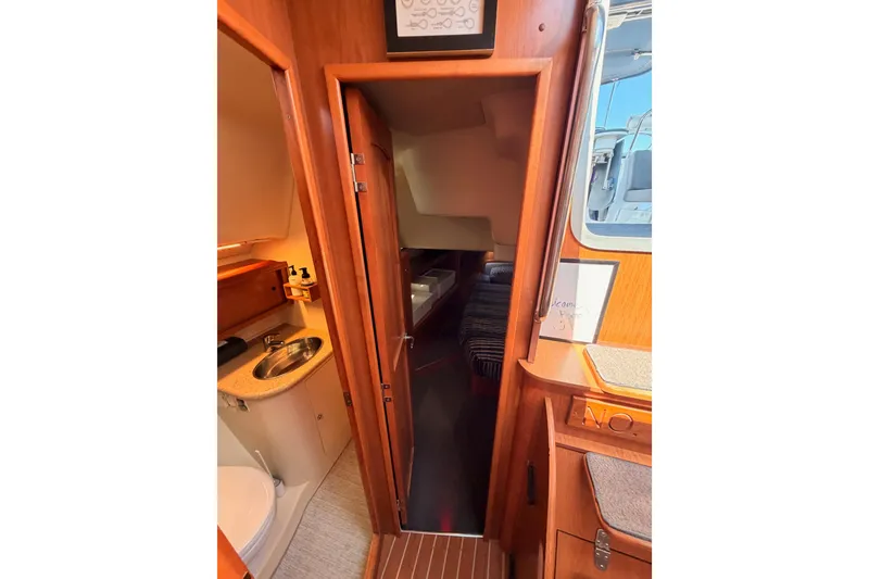 Slide: The Image of Interior view of 2008 Hunter 45 Deck Salon, featuring bathroom and cabin entrance. - 88