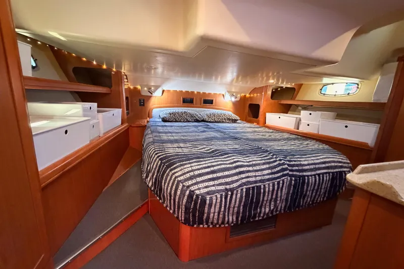 Slide: The Image of Luxurious interior of 2008 Hunter 45 Deck Salon with cozy bed and ample storage. - 89