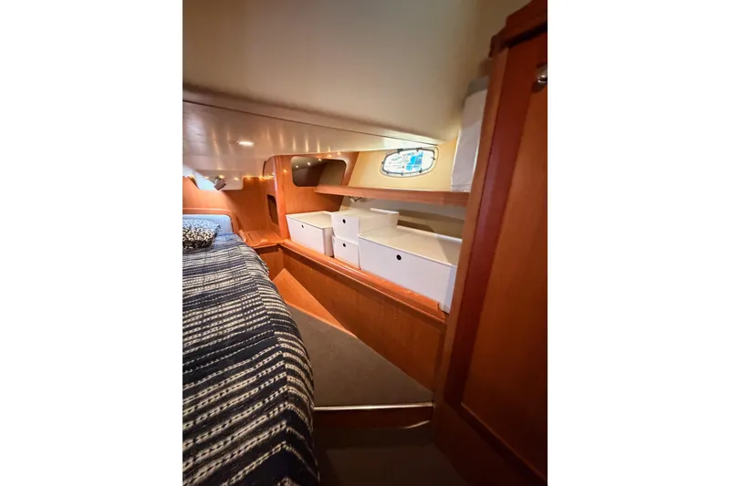Slide: The Image of Interior cabin of 2008 Hunter 45 Deck Salon with cozy bed and storage. - 93