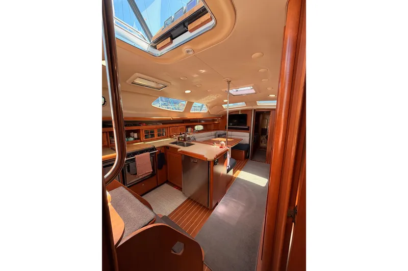 Slide: The Image of Interior of 2008 Hunter 45 Deck Salon yacht with spacious kitchen and seating area. - 98