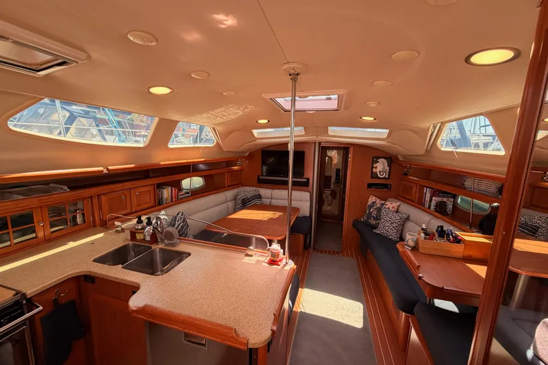 Slide: The Image of Luxurious interior of 2008 Hunter 45 Deck Salon yacht with spacious seating and modern amenities. - 99