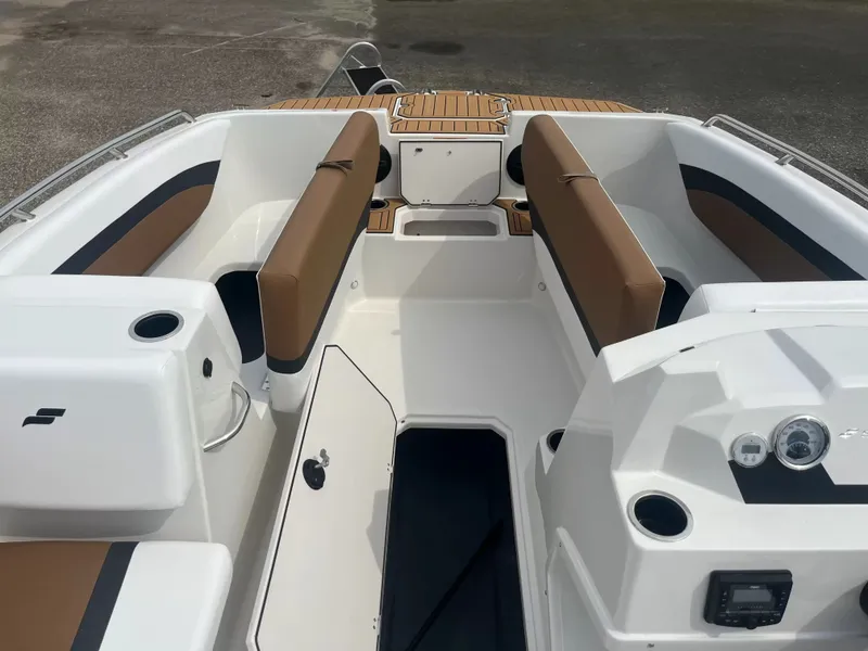 Slide: The Image of The image shows the cockpit of a 2027 Starcraft SVX 171 OB with brown seating. - 4