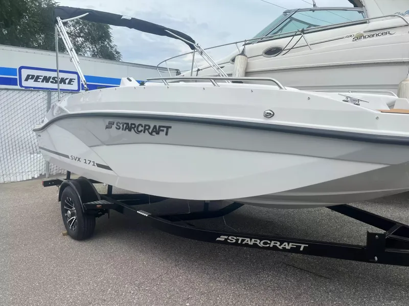 The Image of The image shows a 2027 Starcraft SVX 171 OB boat on a trailer. - 1