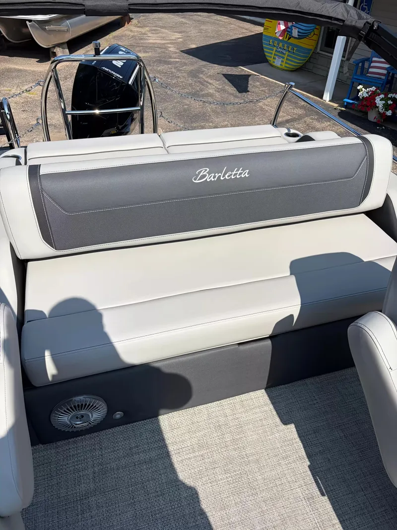 Slide: The Image of The image shows a seating area on a 2027 Barletta CABRIO C22UC/TT boat. - 9