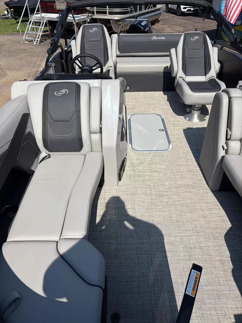 Slide: The Image of The image shows the interior of a 2027 Barletta CABRIO C22UC/TT with sleek seating and carpeted flooring. - 15