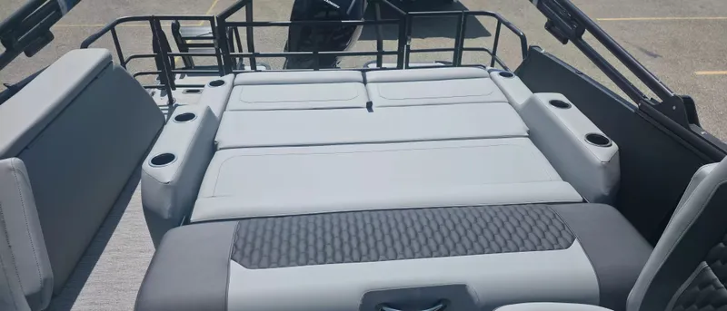 Slide: The Image of Rear view of a 2026 Sylvan X3 ULZ FG/TT with gray upholstery and cup holders. - 11