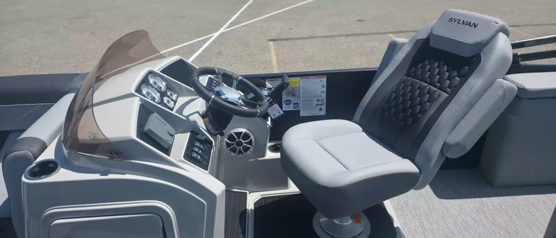 Slide: The Image of The image shows the cockpit of a 2026 Sylvan X3 ULZ FG/TT boat with a cushioned seat. - 6