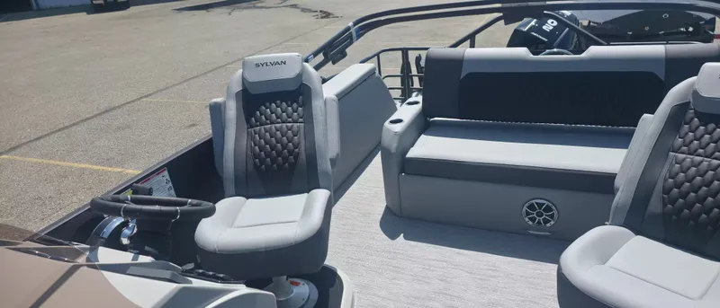 Slide: The Image of The image shows the interior of a 2026 Sylvan X3 ULZ FG/TT boat with gray seating. - 7