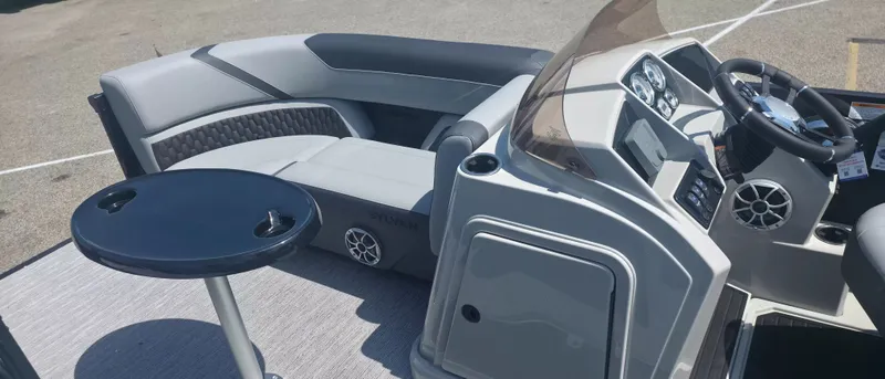 Slide: The Image of The image shows the cockpit of a 2026 Sylvan X3 ULZ FG/TT boat with gray seating and a small table. - 5