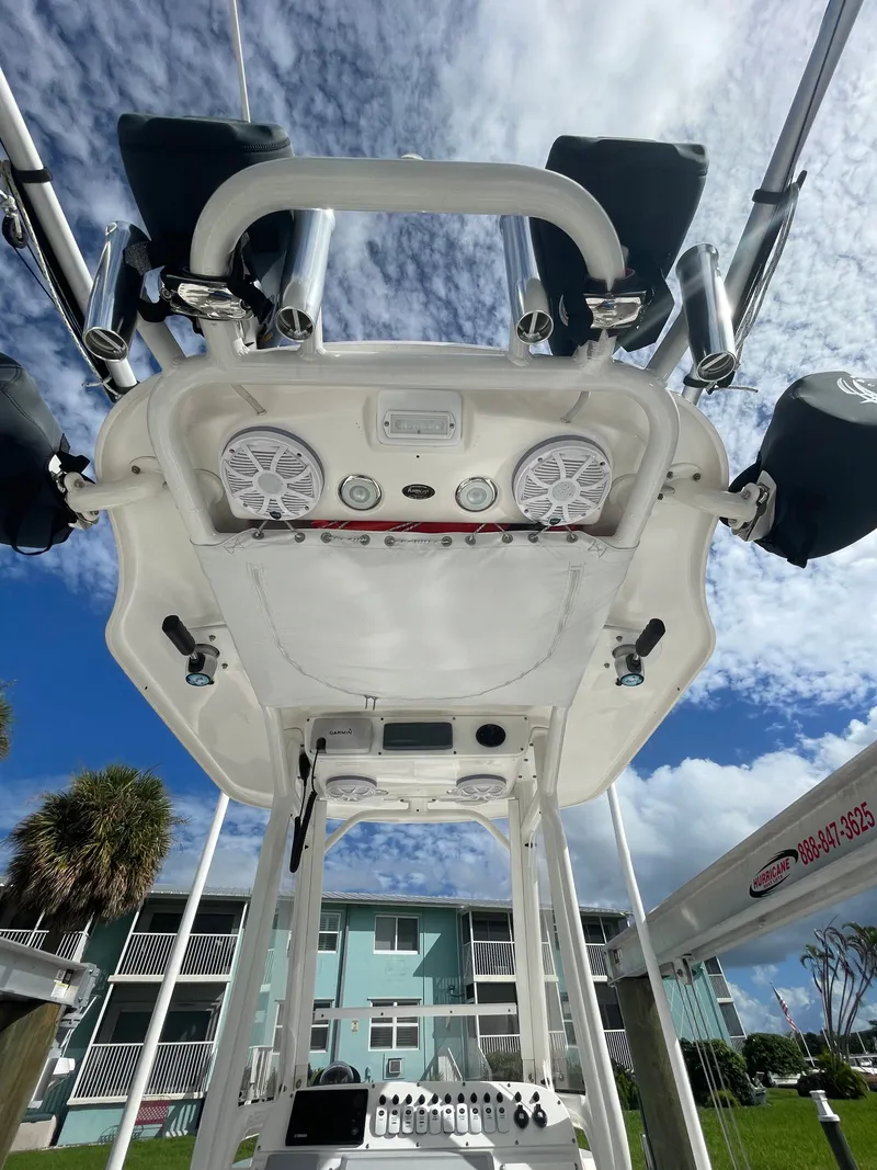 Slide: The Image of View from below of an Everglades 243 Center Console boat's T-top with speakers and lights. - 15