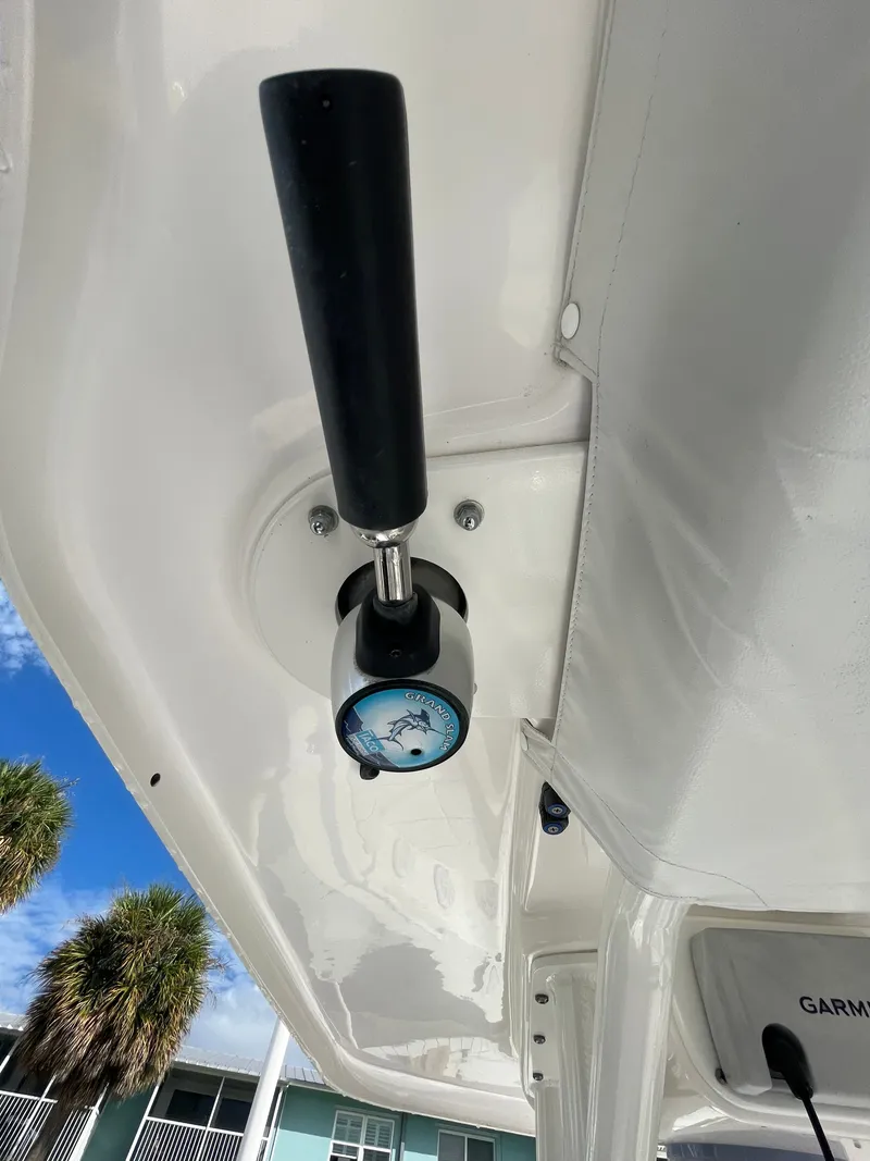 Slide: The Image of Close-up of a boat lever with a black handle, mounted on a white surface. - 16