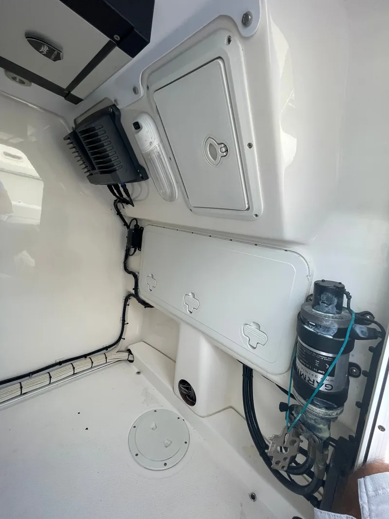 Slide: The Image of Interior view of a 2012 Everglades 243 Center Console boat with technical components. - 18