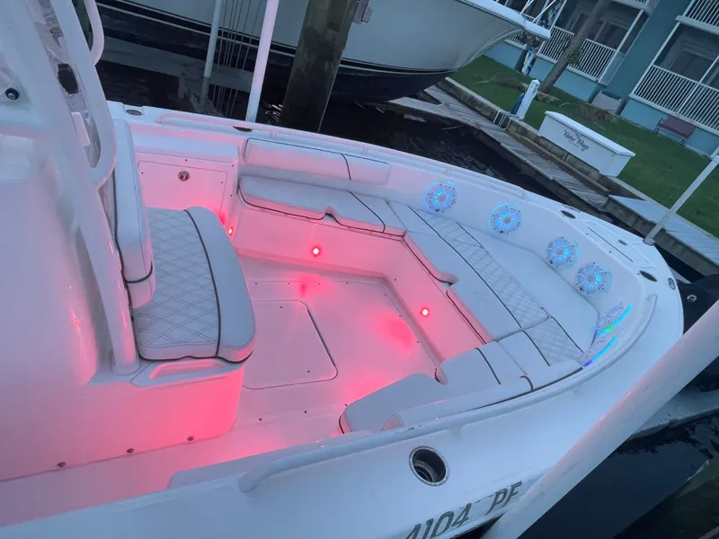 Slide: The Image of The boat features white upholstery and red LED lighting in the seating area. - 30
