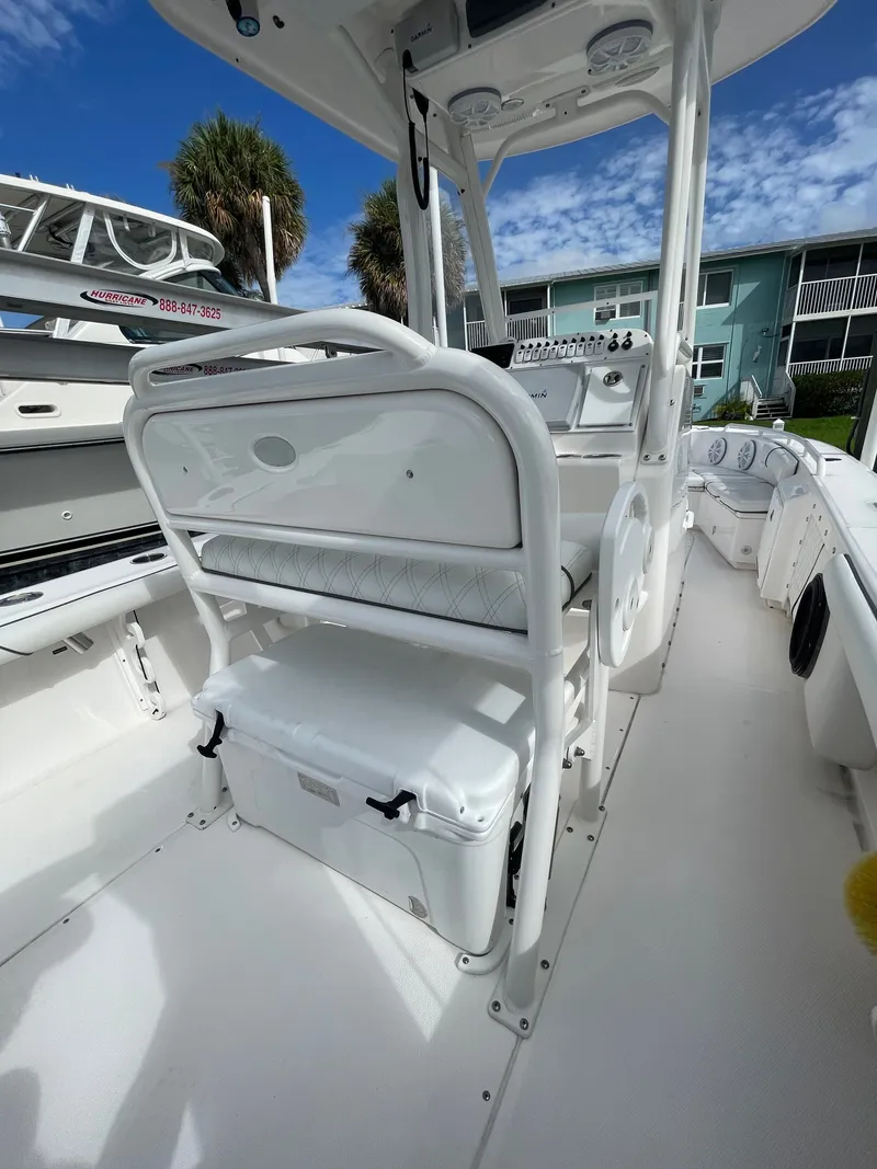 Slide: The Image of The image shows the cockpit of a 2012 Everglades 243 Center Console boat. It features white upholstery and a modern helm. - 6