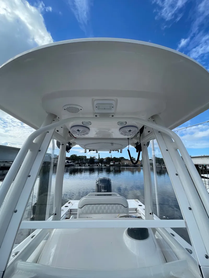 Slide: The Image of View from the console of an Everglades 243 Center Console boat overlooking calm water. - 9