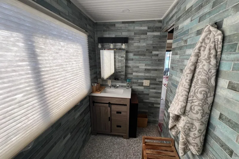 Slide: The Image of Bathroom interior of a 1993 Sumerset houseboat with modern vanity and textured walls. - 19