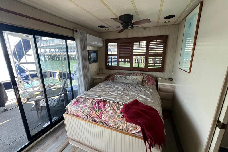 Slide: The Image of Cozy bedroom in a 1993 Sumerset houseboat with waterfront view and sliding glass doors. - 21
