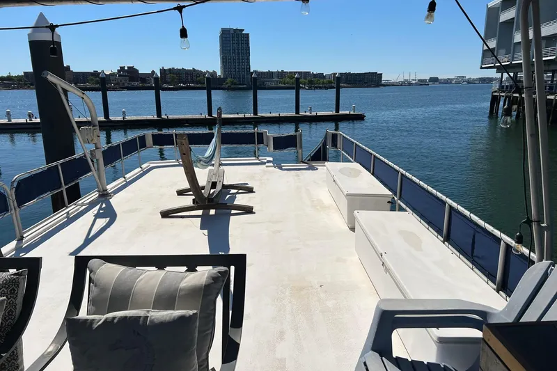 Slide: The Image of Sunny deck of a 1993 Sumerset houseboat with waterfront view. - 31