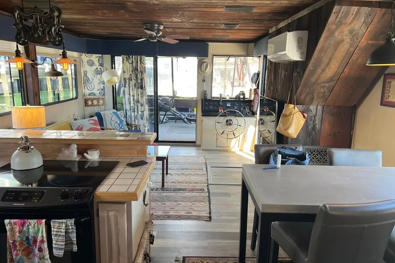 Slide: The Image of Interior of a 1993 Sumerset houseboat with rustic decor and modern amenities. - 39