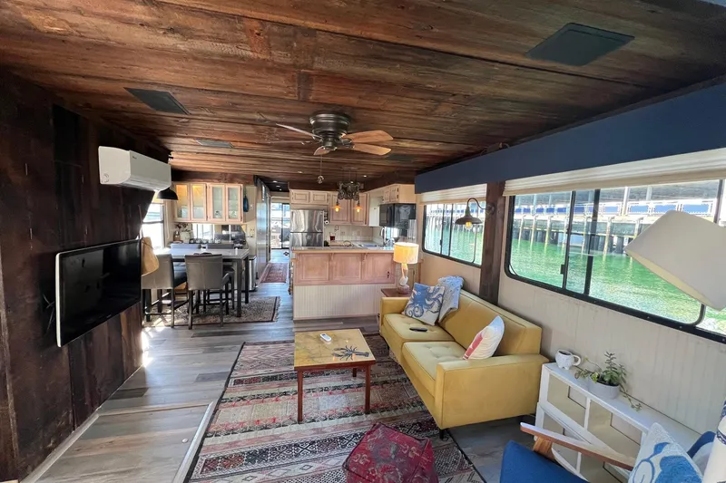 Slide: The Image of Interior of a 1993 Sumerset houseboat with cozy living area and kitchen. - 5
