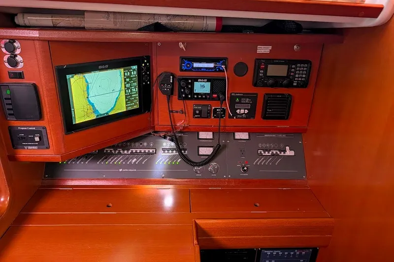 Slide: The Image of Navigation equipment on a 2006 Grand Soleil 50 yacht, featuring control panels and electronic displays. - 12