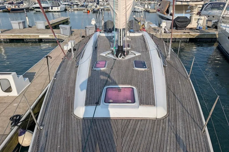 Slide: The Image of 2006 Grand Soleil 50 yacht docked at marina, showcasing sleek deck design. - 19