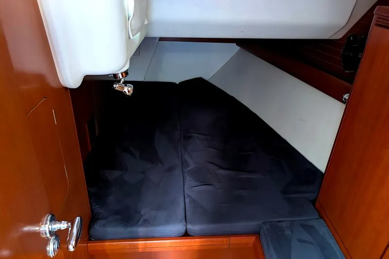 Slide: The Image of Cozy cabin interior of 2006 Grand Soleil 50 yacht with dark bedding. - 7