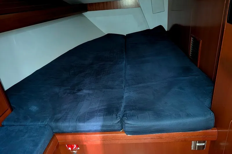 Slide: The Image of Interior cabin of 2006 Grand Soleil 50 yacht with dark blue bedding. - 11