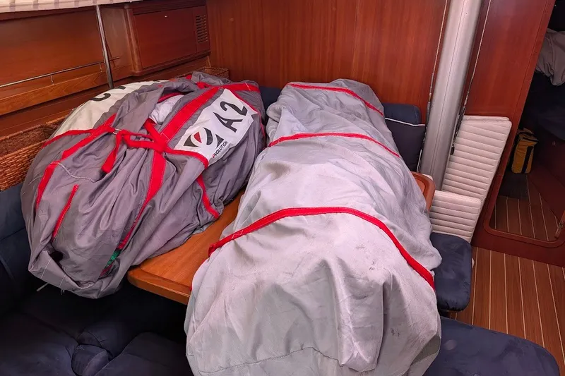 Slide: The Image of Sail bags on a Grand Soleil 50 yacht's wooden interior table, 2006 model. - 18