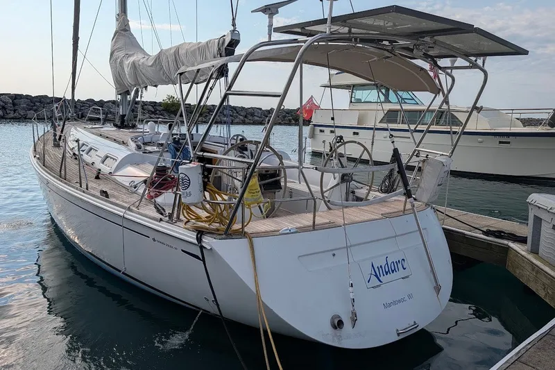 Slide: The Image of 2006 Grand Soleil 50 sailboat docked, featuring a sleek design and spacious deck. - 4