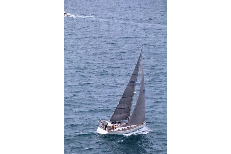 Slide: The Image of Sailing yacht Grand Soleil 50, 2006 model, navigating open sea with full sails. - 0