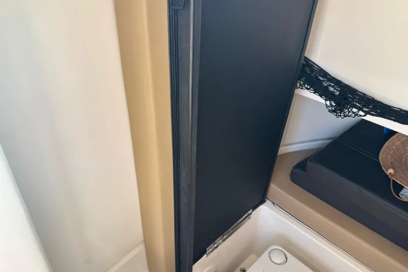 Slide: The Image of Interior storage compartment of 2022 Sea Ray SLX 250 boat. - 45