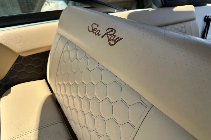 Slide: The Image of Luxurious interior of 2022 Sea Ray SLX 250 boat with elegant beige upholstery. - 42