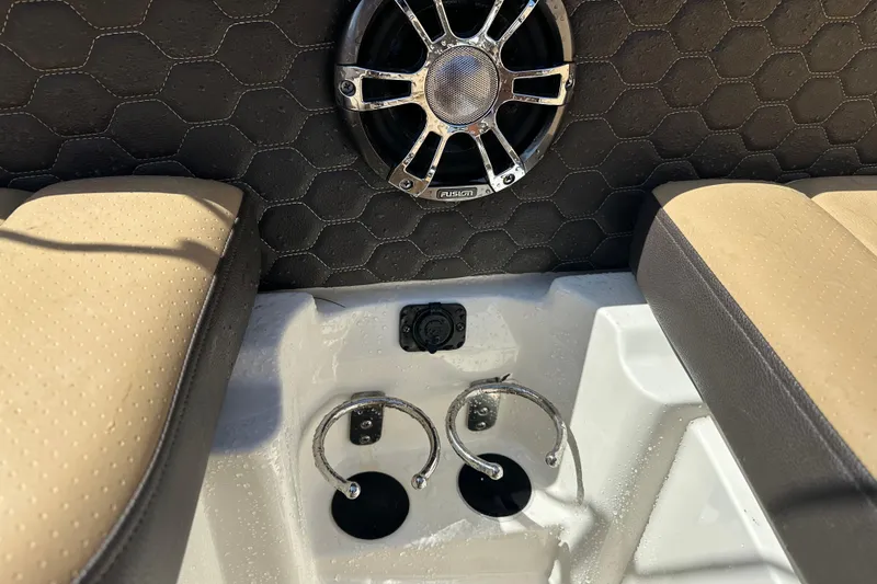 Slide: The Image of Interior of 2022 Sea Ray SLX 250 boat with speaker and cup holders. - 39