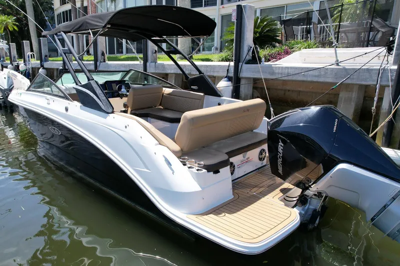 Slide: The Image of 2022 Sea Ray SLX 250 boat docked, featuring sleek design and powerful Mercury engine. - 4