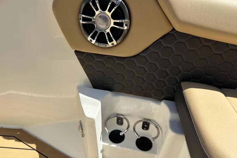 Slide: The Image of Speaker and cup holders on 2022 Sea Ray SLX 250 boat interior. - 38