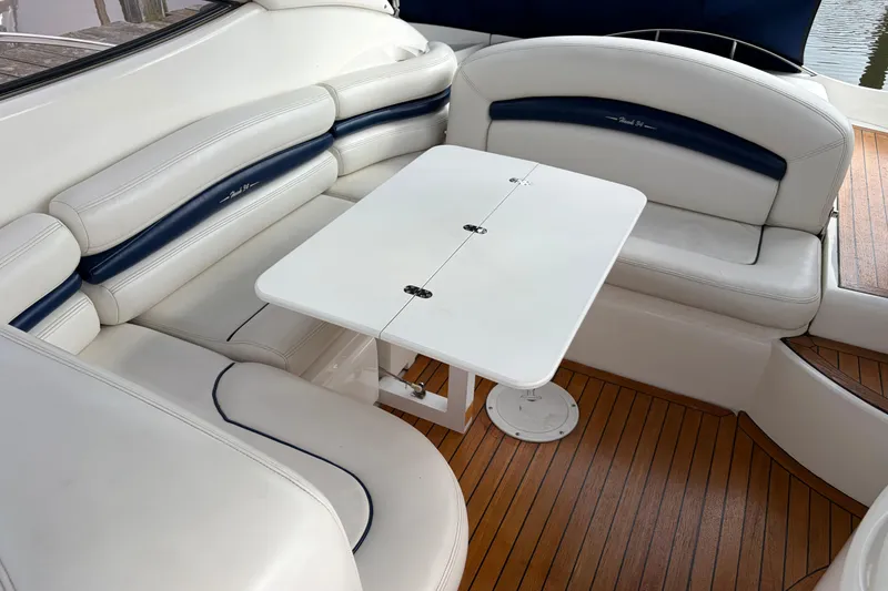 Slide: The Image of Luxurious seating area on a 2000 Sunseeker Superhawk 34 yacht with a foldable table. - 10