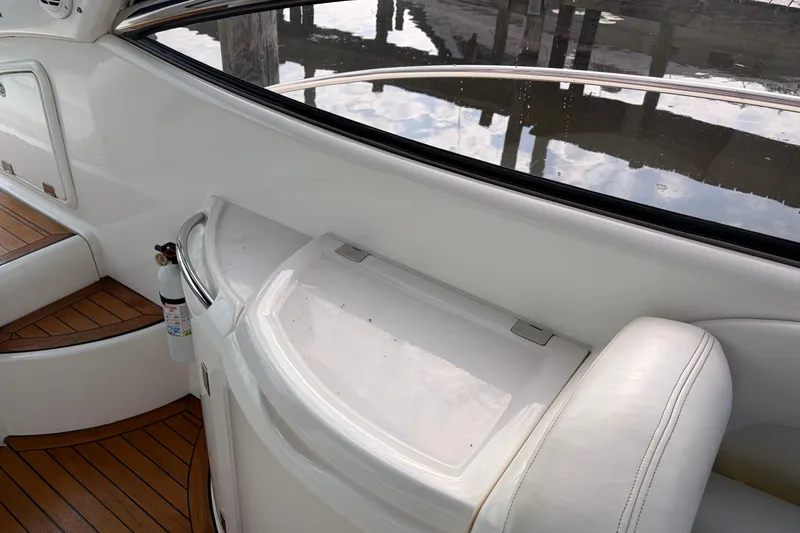 Slide: The Image of Interior view of a 2000 Sunseeker Superhawk 34 yacht with wooden flooring. - 11